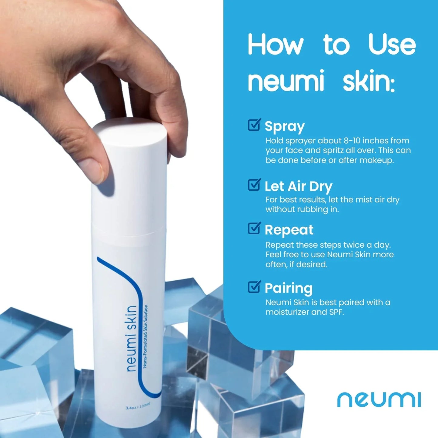 Hand holding Neumi Skin spray bottle with usage instructions and blue acrylic blocks.