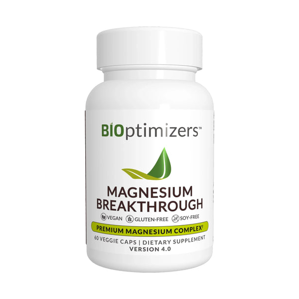A bottle of BiOptimizers Magnesium Breakthrough supplement, version 4.0, with capsules inside.