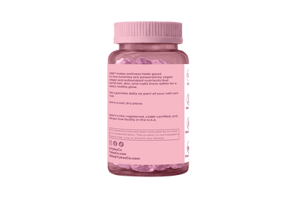 Pink supplement bottle with visible text on a white background