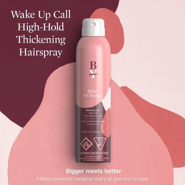 Pink Better Not Younger Wake Up Call High-Hold Thickening Hairspray bottle on abstract background